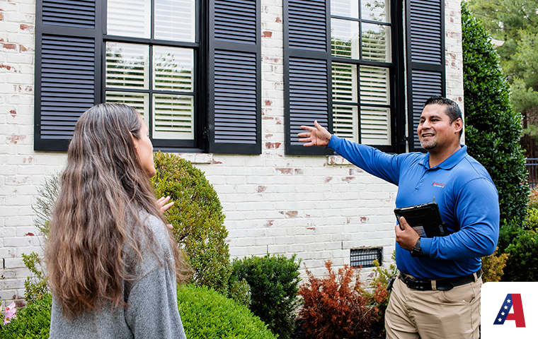 pest expert discussing pest control with homeowner