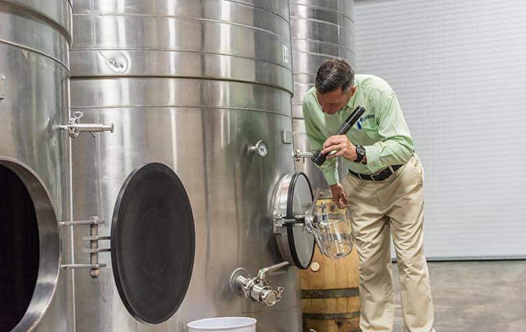 nashville pest control technician inspecting business