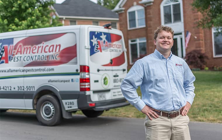 Learn More About Home Pest Control In Old Hickory TN all american tech standing in front of service vehicle outside of clients home in old hickory tennessee