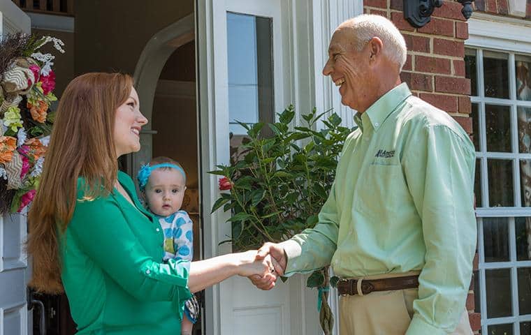 No Contracts! Cancel Pest Control Services Anytime nashville pest control technician greeting homeowner
