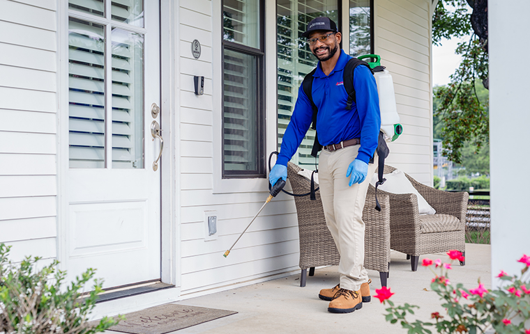 Learn More About Home Pest Control In Portland TN all american tech standing outside of clients home in portland tennessee