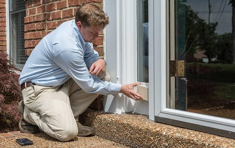 Learn More About Termite Warranties technician inspecting tennessee home