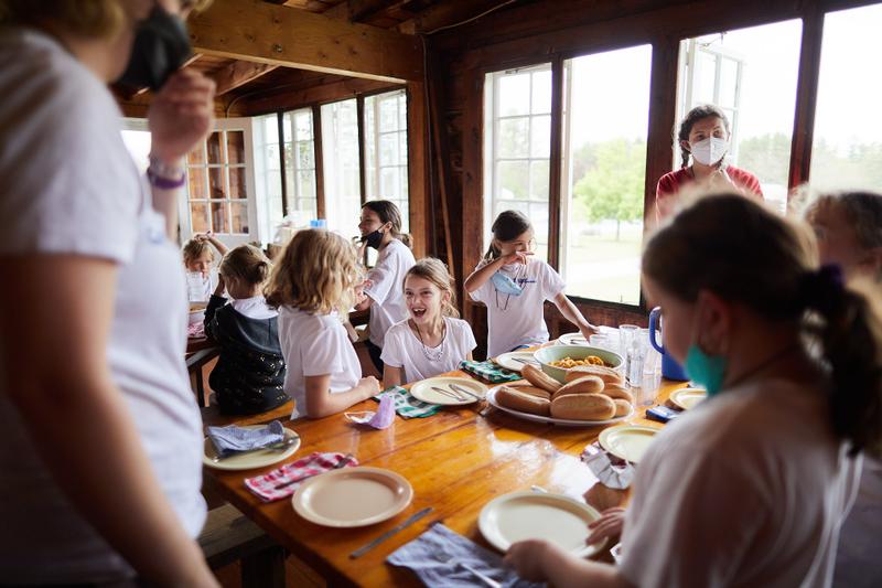 Girls join for lunch in Camp Tapawingo's Dining Hall.