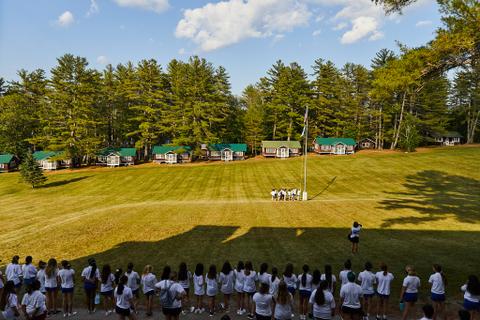 The sun shines over Camp Tapawingo in Maine