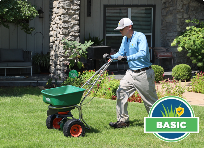 lawn care specialist overseeding a lawn