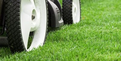 lawn mower cutting grass in tulsa