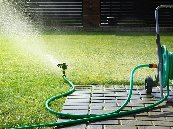 lawn sprinkler in tulsa yard