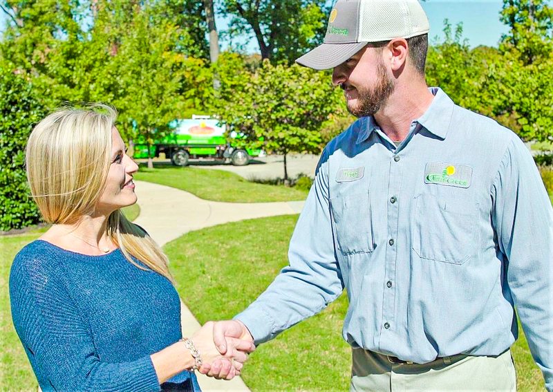 lawn care tech with customer in tulsa