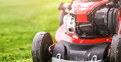 tulsa homeowner mowing the lawn