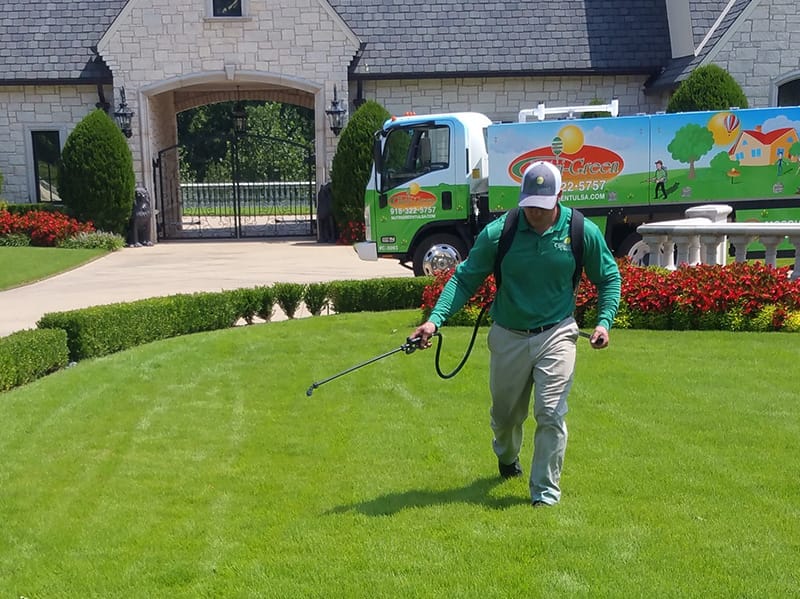 lawn care specialist treating tulsa yard