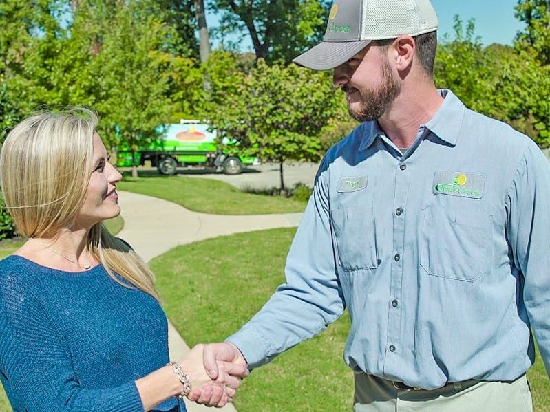 nutri-green technician greeting homeowner