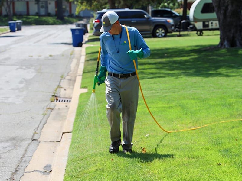 nutri-green lawn care specialist treating lawn